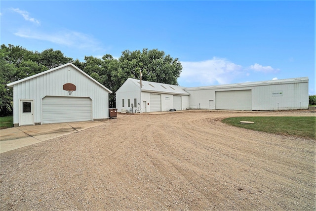 exterior space with an outbuilding and a garage