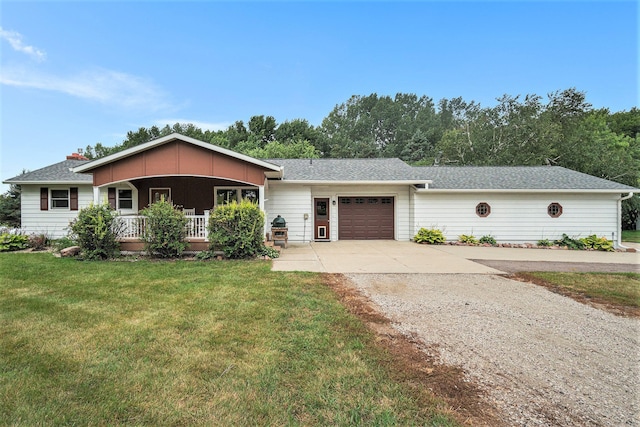 ranch-style home with a front yard, a garage, and covered porch