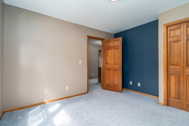 unfurnished bedroom featuring light colored carpet