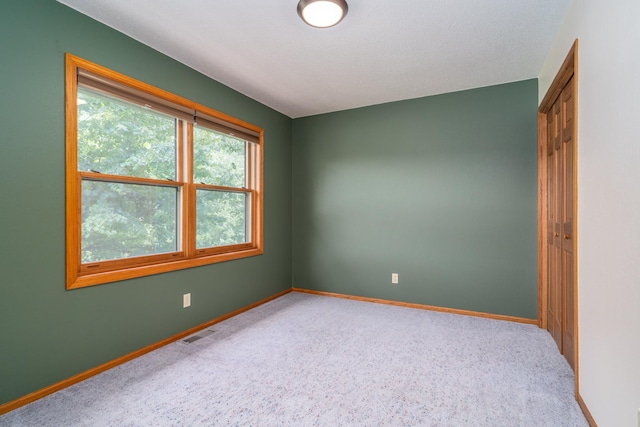 view of carpeted spare room