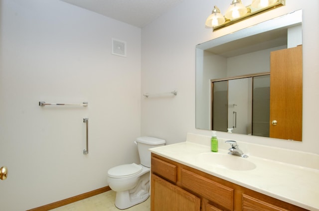 bathroom featuring walk in shower, vanity, and toilet