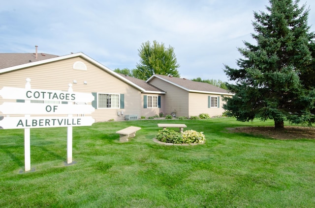 back of house with a yard