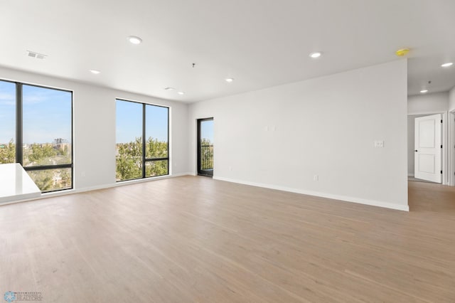 spare room featuring light wood-type flooring