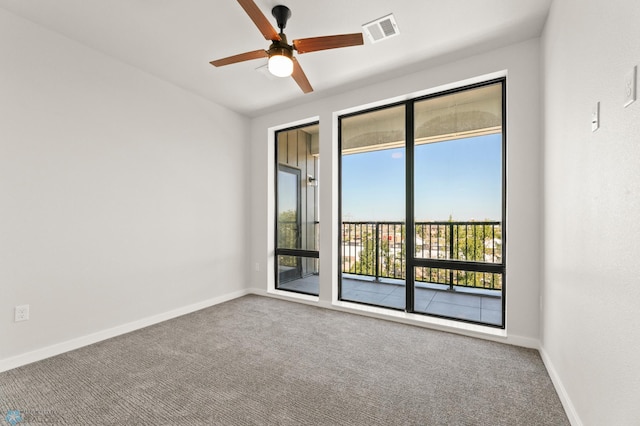 carpeted empty room with ceiling fan