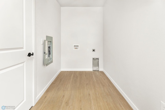 laundry room with hookup for a washing machine, hookup for an electric dryer, and light wood-type flooring