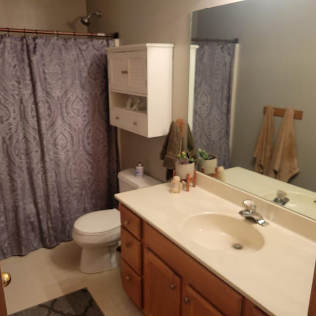 bathroom featuring tile patterned flooring, vanity, toilet, and a shower with curtain