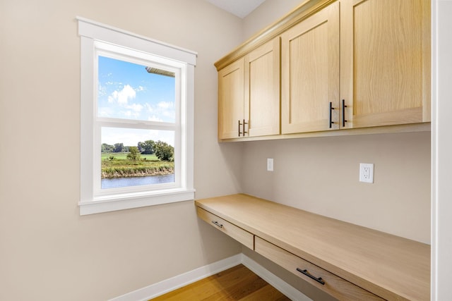 mudroom with light hardwood / wood-style floors