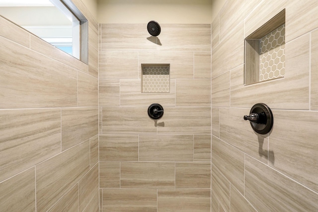 bathroom featuring tiled shower