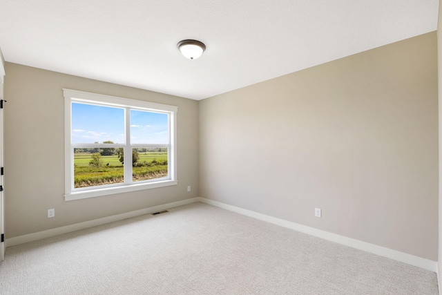 spare room with carpet flooring