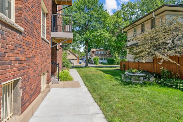 view of yard featuring a balcony