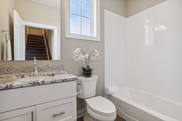 full bathroom featuring shower / bathing tub combination, vanity, and toilet