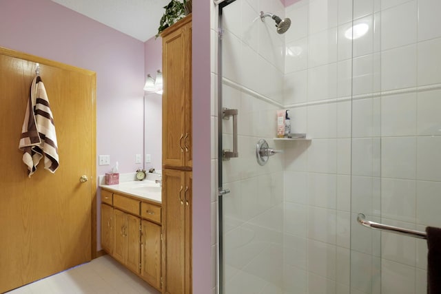 full bathroom with a stall shower and vanity