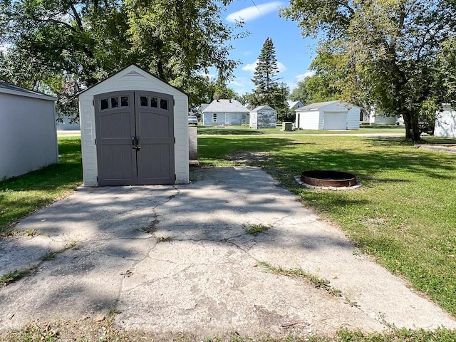 exterior space with a yard and a fire pit