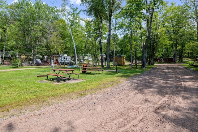 view of property's community with a yard