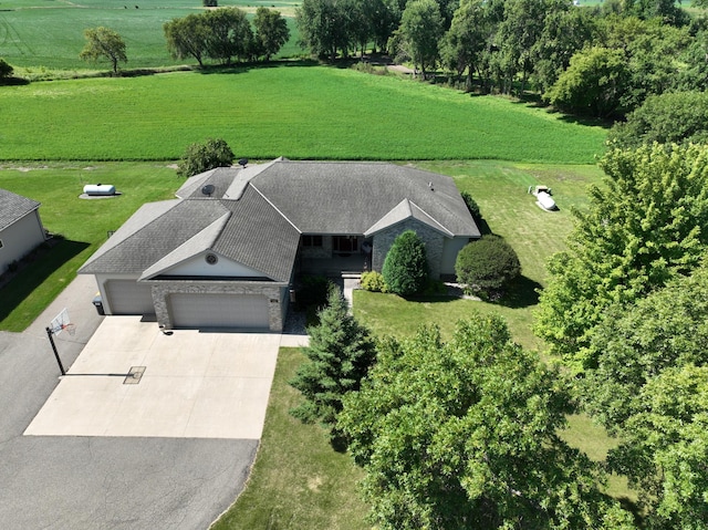 birds eye view of property with a rural view