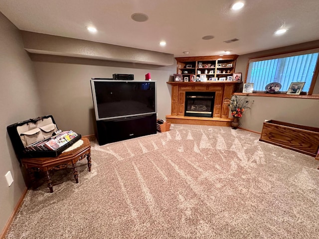 living area featuring carpet