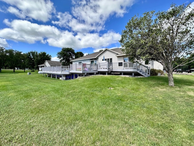 view of yard featuring a wooden deck