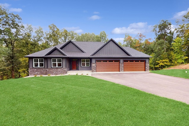 craftsman-style home with a front lawn and a garage