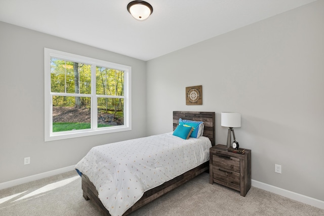 bedroom with light colored carpet