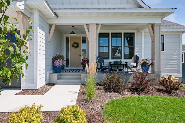 doorway to property featuring covered porch