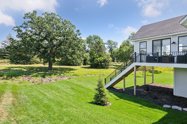 view of yard featuring a wooden deck