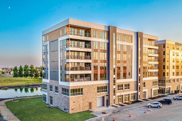 outdoor building at dusk featuring a water view