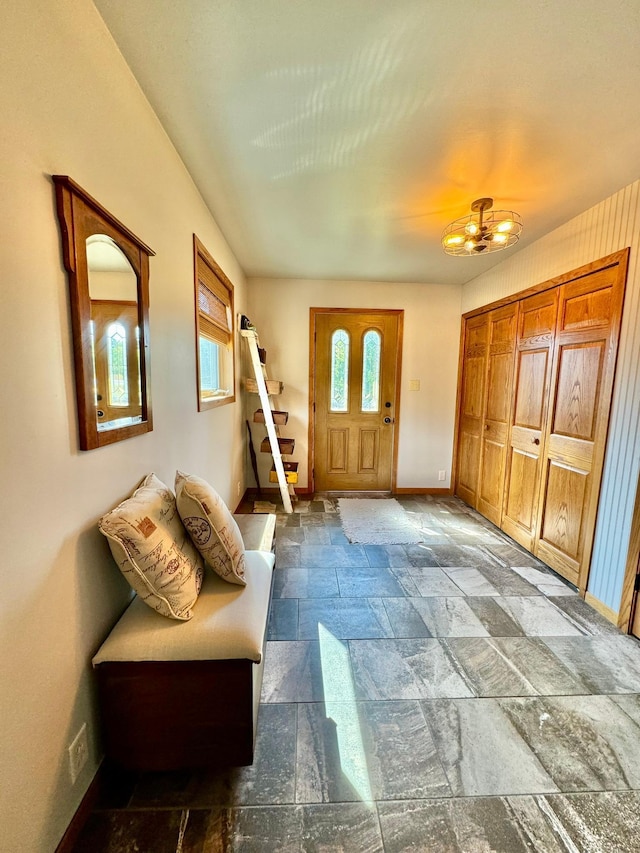 foyer with a notable chandelier