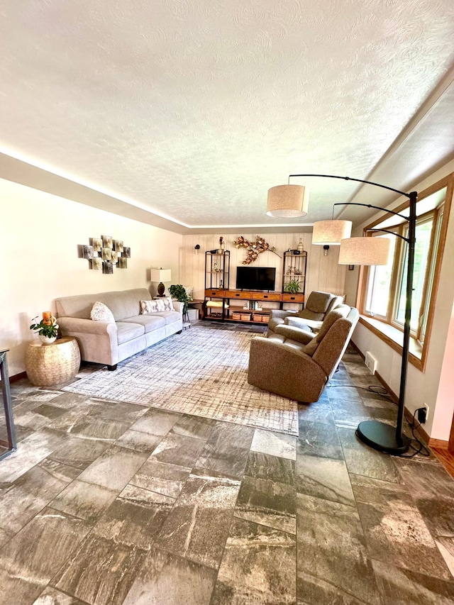 living room with a textured ceiling