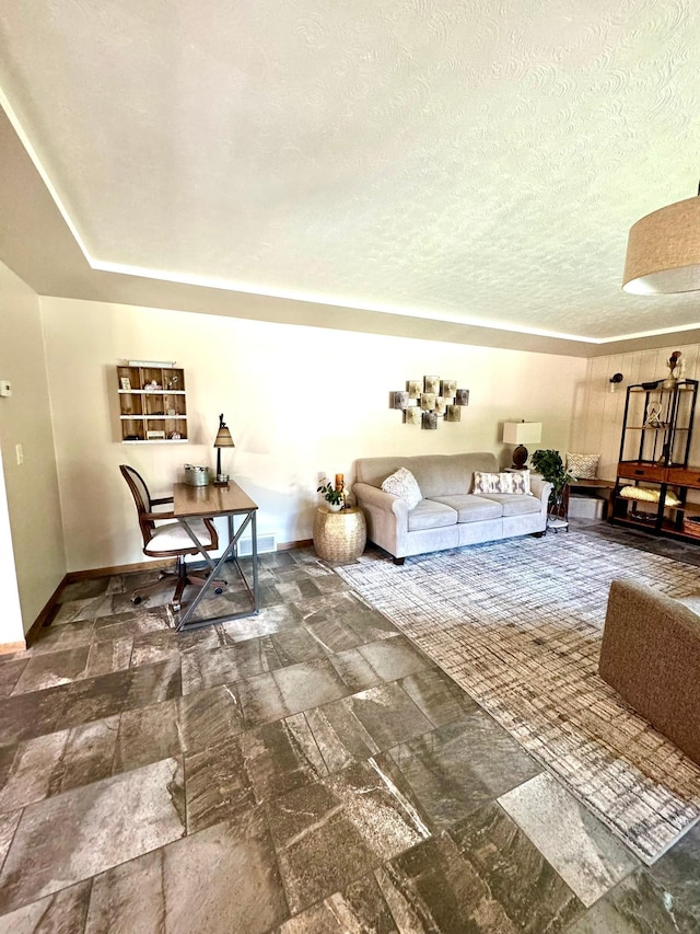 living room featuring a textured ceiling