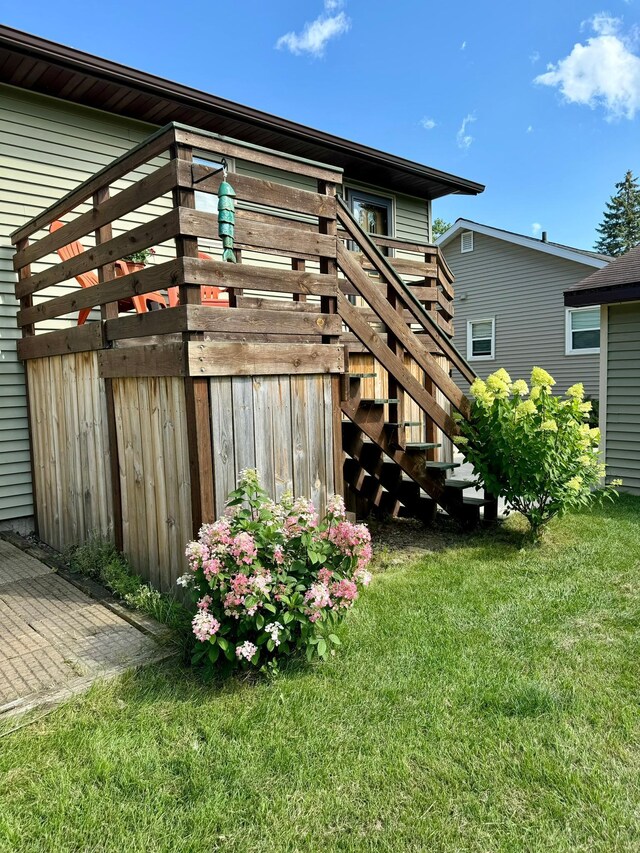 rear view of house featuring a lawn