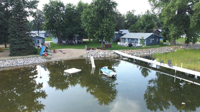 exterior space with a yard and a water view