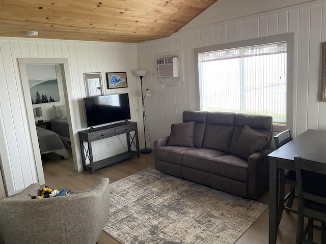 living area with wood finished floors, wooden ceiling, vaulted ceiling, and a wall mounted AC