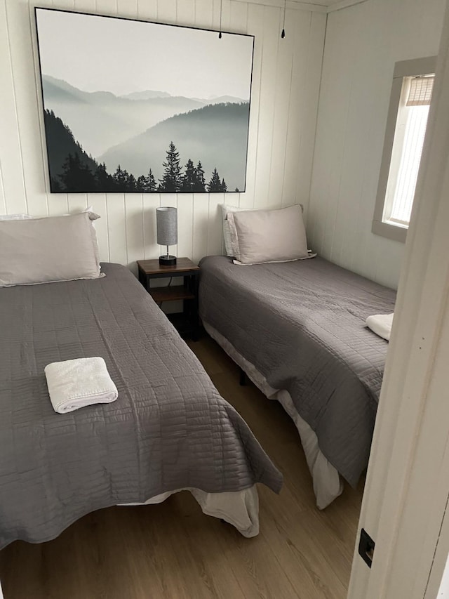 bedroom with wood finished floors