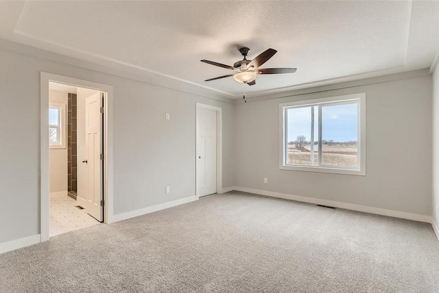 2066 151st Ave NW, Andover, MN 55304 - unfurnished room featuring light colored carpet, visible vents, baseboards, and ceiling fan