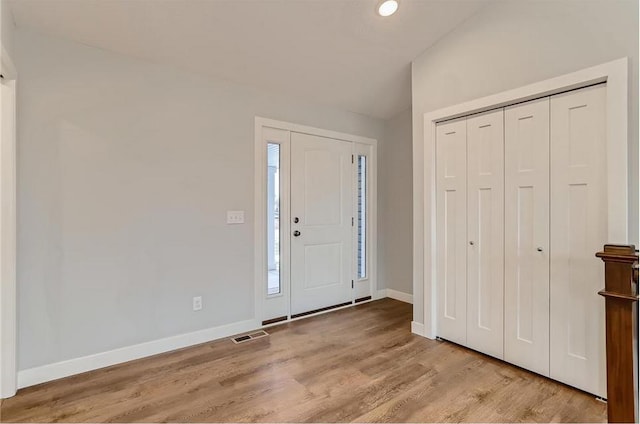 2066 151st Ave NW, Andover, MN 55304 - entrance foyer with lofted ceiling, recessed lighting, baseboards, visible vents, and wood finished floors