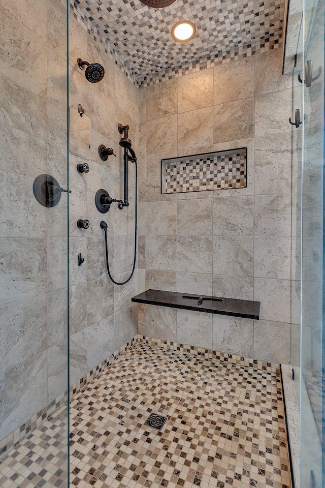 full bath with a shower stall