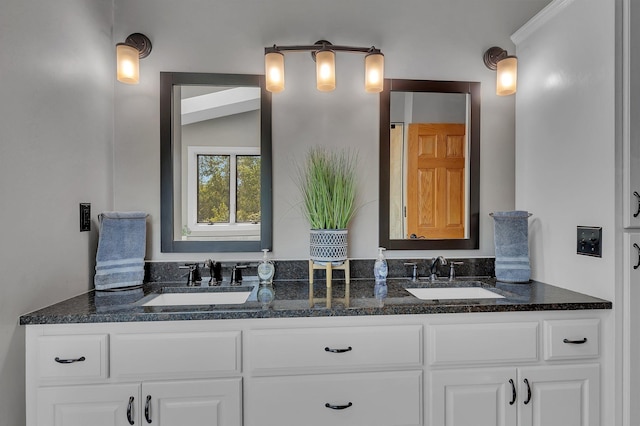 bathroom featuring double vanity and a sink