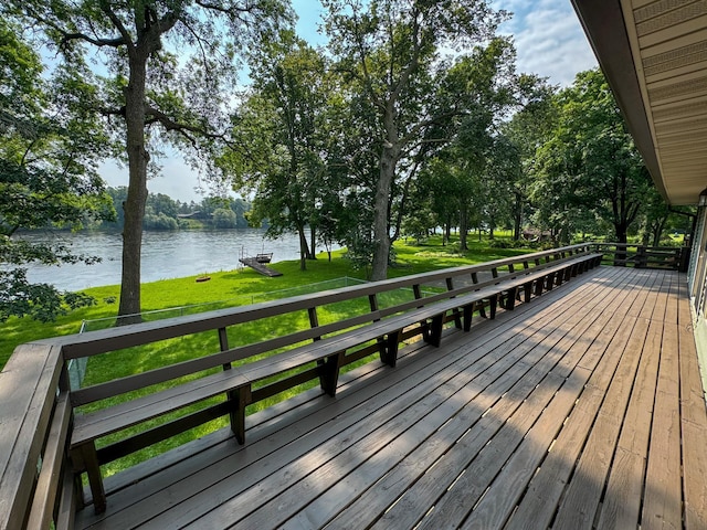 deck featuring a water view and a yard