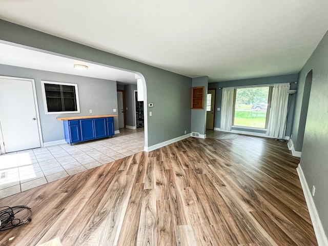 unfurnished living room with light wood-type flooring