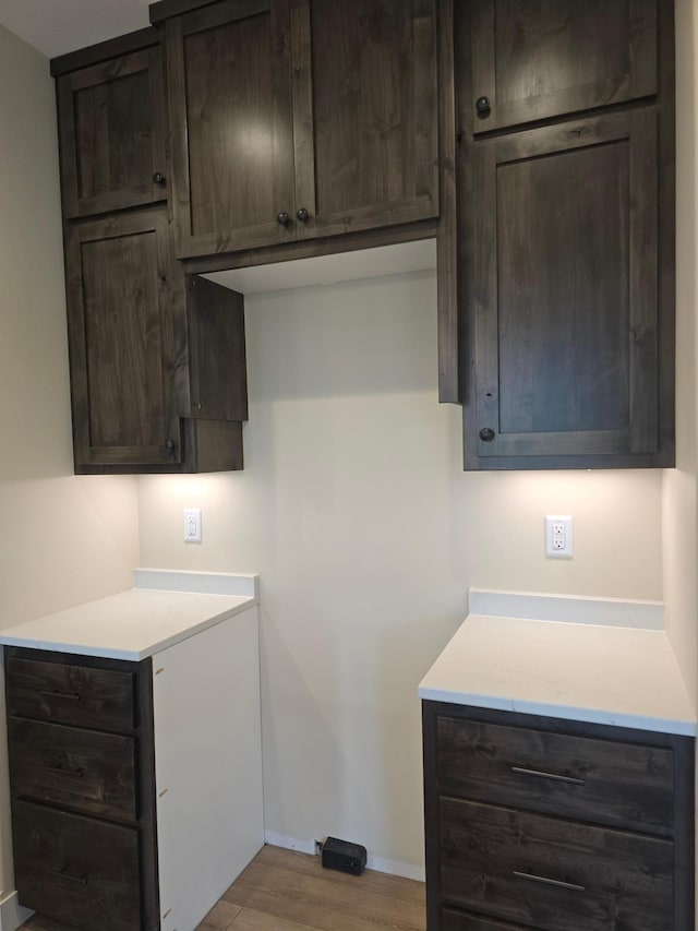 laundry room with light wood-type flooring