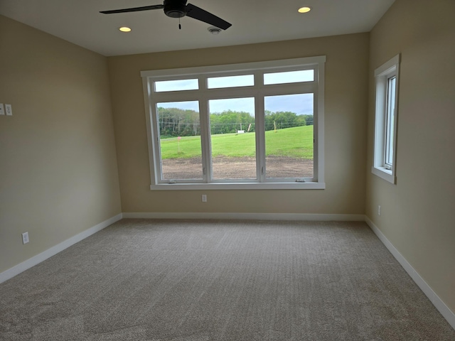 carpeted empty room with ceiling fan