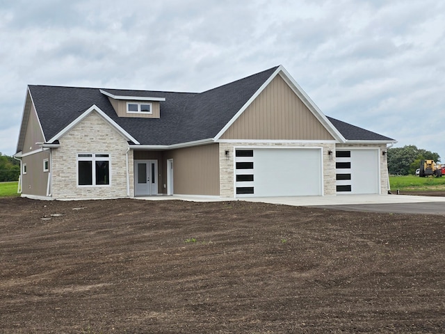 craftsman inspired home with a garage