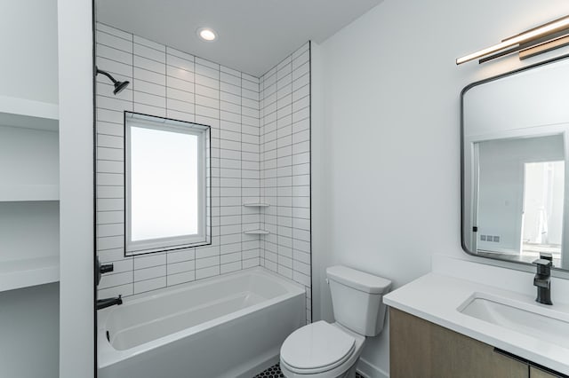 full bathroom with tiled shower / bath, a wealth of natural light, vanity, and toilet