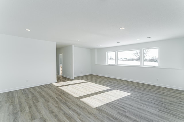 empty room with hardwood / wood-style floors