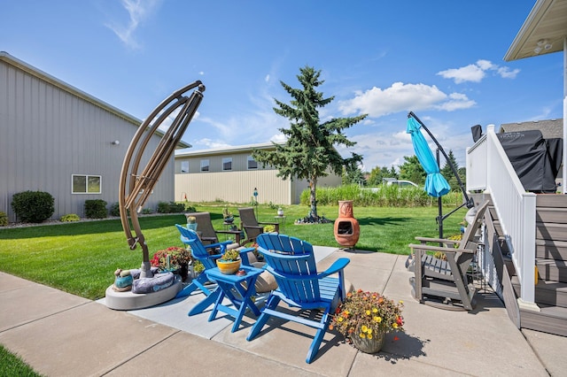 view of patio / terrace with an outdoor fire pit