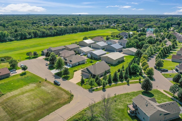 bird's eye view with a forest view and a residential view