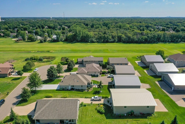 birds eye view of property featuring a forest view and a residential view