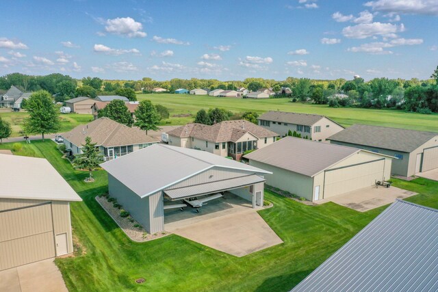 birds eye view of property with a residential view