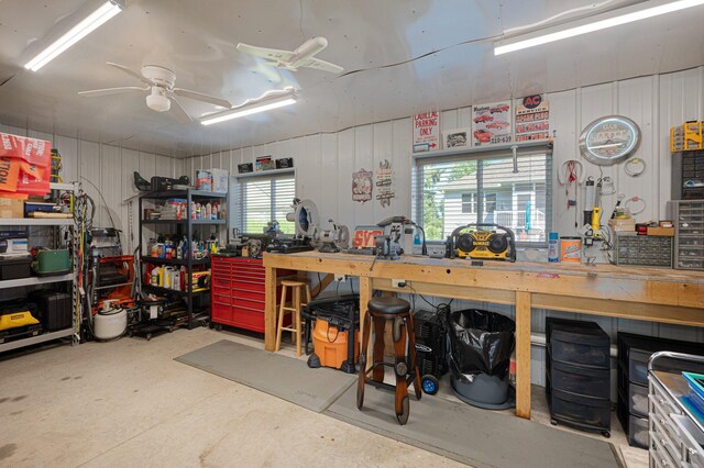 garage featuring a workshop area and a ceiling fan