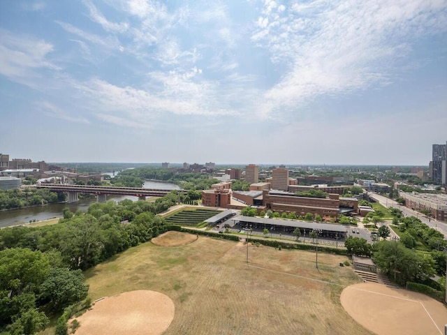 birds eye view of property with a water view and a view of city